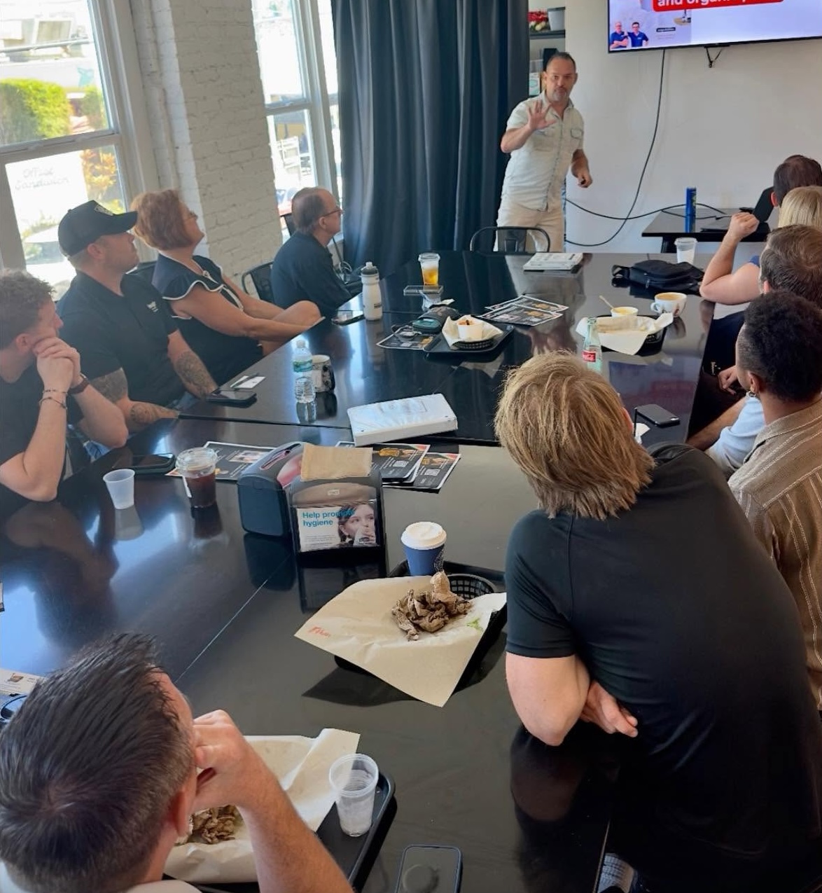 Brian Orr presenting at a Lunch & Learn session for a business group.