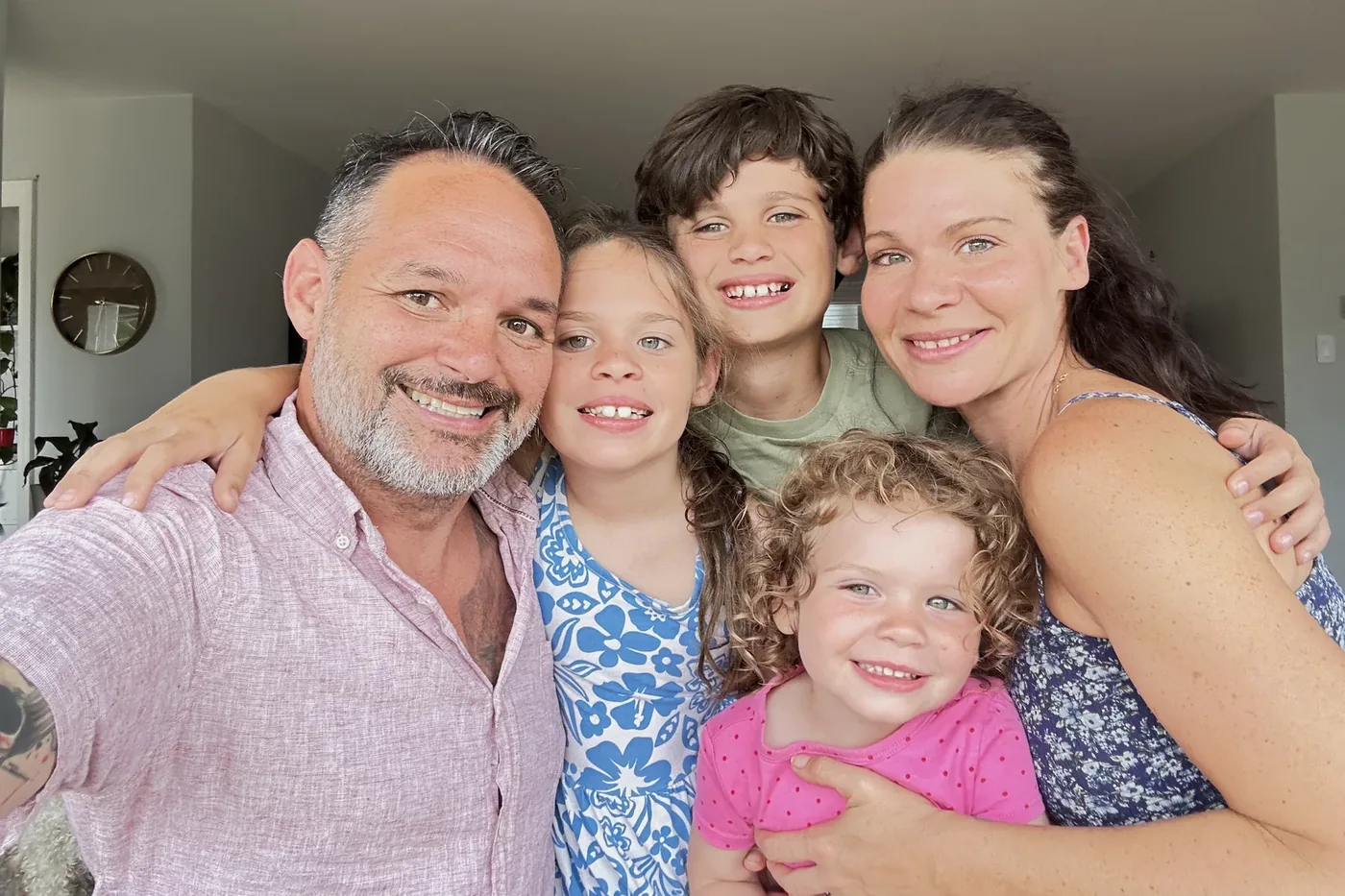 Brian Orr with his wife and their three children at home.